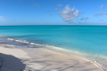 Beach of fine white sand and azure sea. Long Island, Bahamas