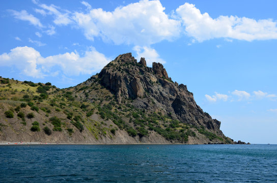 Kara dag Mountain towers over the Black Sea near the village of Koktebel, Crimea, Russia