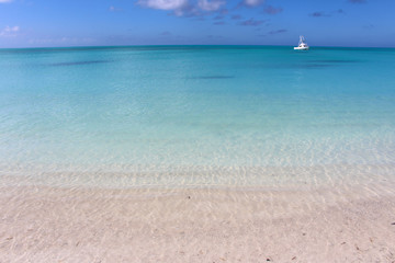 Fototapeta na wymiar Beach of fine white sand and azure sea. Long Island, Bahamas