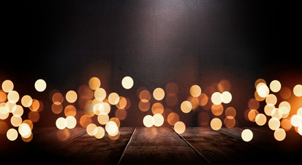 Empty dark room scene. Old brick wall and wooden floor. Blur bokeh lights. Abstract bokeh light....