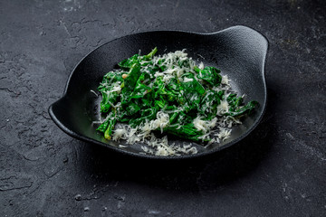 Spinach with cream and baked Parmesan cheese