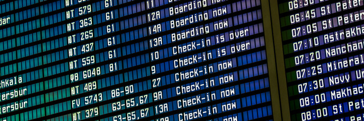 Flights information board in an airport terminal