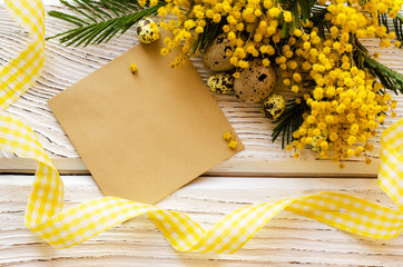 Easter egg and beautiful Mimosa flower on a wooden background. - Image