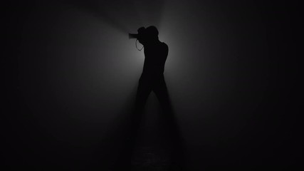 Silhouette of male photographer