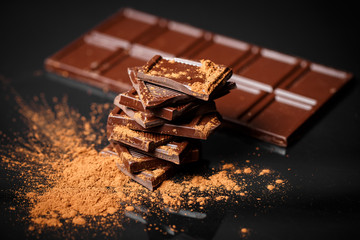 dark chocolate stack and cocoa powder