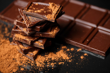 dark chocolate stack and cocoa powder