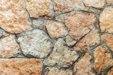 Fragment of a stone wall.
