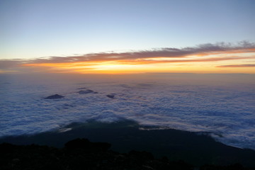 Sunrise over the clouds from the top of Mount Fuji, Japan