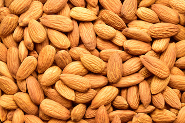 Almonds top view texture, background, dry fruit also called as badam.