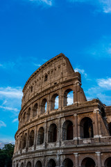 Obraz premium Golden sunset at the Great Roman Colosseum (Coliseum, Colosseo), also known as the Flavian Amphitheatre. Famous world landmark. Scenic urban landscape.