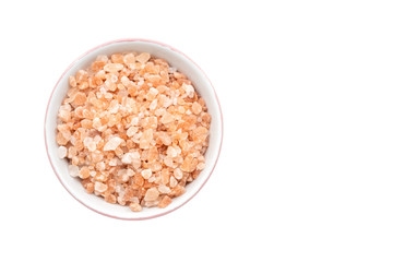 Bowl of pink himalayan salt on white background