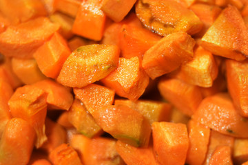 fried carrot pieces macro with blur effect