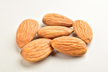 Closeup of almonds, isolated on the white background.