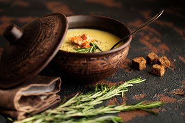 Fish cream soup with Salmon, cheese, Potatoes and herbs in white Soup Bowls.