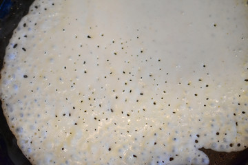 crepe dough in a pan macro fragment, pancake, Russian traditional food