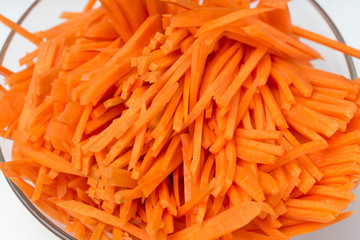 Sliced carrots Carrots background. Carrot sliced into pieces. Carrot straws.