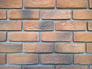 Fototapeta premium Orange exterior decorative brick wall