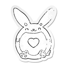 distressed sticker of a cartoon rabbit with love heart