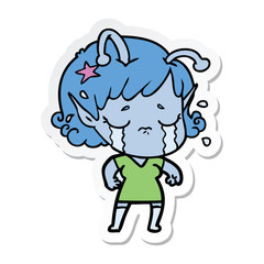 sticker of a cartoon crying alien girl