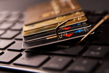 Credit card phishing attack over dark background, close-up