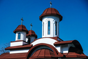 White brown Orthodox Christian church roof with three or 3 Jesus cross on top