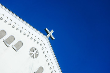 Close up view of Christianity cross of Jesus Christ on top of a church