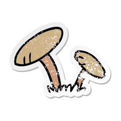 distressed sticker cartoon doodle of some mushrooms