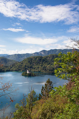Panoramic view of Bled lake with the church in the island in a sunny day, from the castle