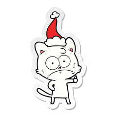 sticker cartoon of a nervous cat wearing santa hat