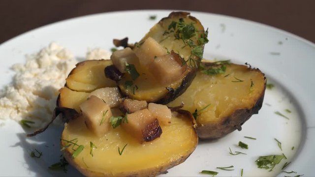 Baking botatoes bnd bacon In The oven with white cheese. 4k