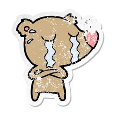 distressed sticker of a cartoon crying bear