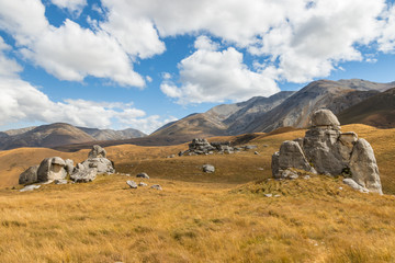 Fototapeta premium limestone rock formation on grassy hills of Castle Hill Reserve, South Island, New Zealand
