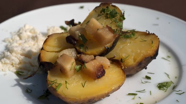 Baking botatoes bnd bacon In The oven with white cheese. 4k