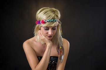 Fototapeta premium portrait of beautiful young woman wearing hippie headband
