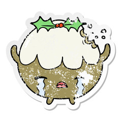 distressed sticker of a cartoon chrstmas pudding