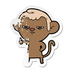 distressed sticker of a cartoon annoyed monkey
