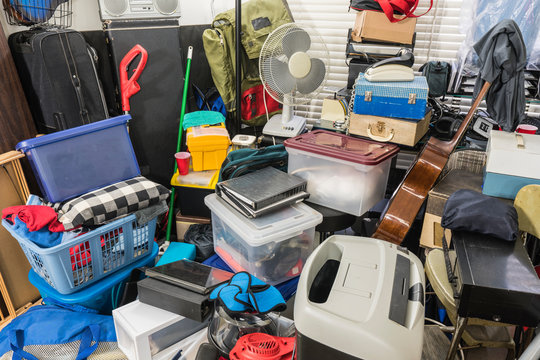 Hoarder home packed with stored boxes, vintage electronics, files, business equipment and household items.