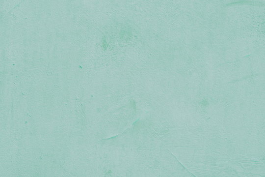 Cement painted wall background, baby-blue pastel color texture