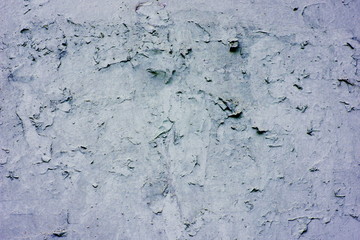 Background of a blue stucco coated and painted exterior, rough cast of cement and concrete wall texture