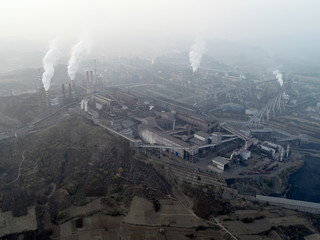 Aerial view of big factory in China.Air pollution by smoke coming out of chimneys. Coal Fossil Fuel Power Plant Smokestacks Emit Carbon Dioxide Pollution. Chengde, China. 10/22/2018