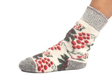 Wool sock on woman's feet isolated on white background