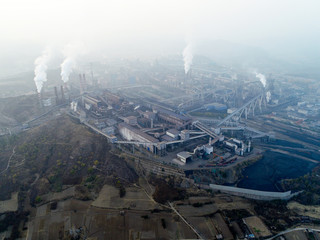 Aerial view of big factory in China.Air pollution by smoke coming out of chimneys. Coal Fossil Fuel Power Plant Smokestacks Emit Carbon Dioxide Pollution. Chengde, China. 10/22/2018