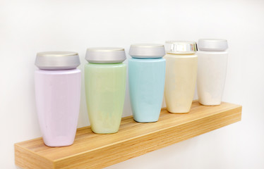 bottles with cosmetics on the shelf for editing. delicate body and face cosmetics