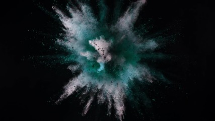 Super slowmotion shot of color powder explosion isolated on black background.