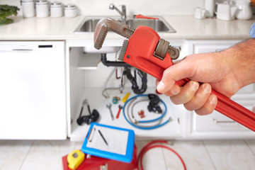 Plumber with wrench