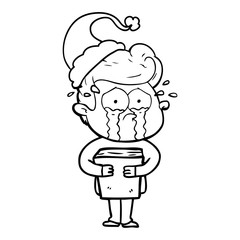 line drawing of a crying man holding book wearing santa hat