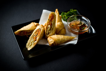 Thai food. Spring rolls with vegetables and sweet and sour sauce