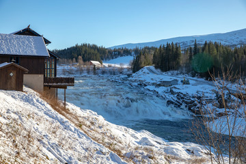 The Salmon waterfall in Wefsna river on a cold winter day, in Northern Norway