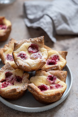 Obraz na płótnie Canvas Raspberry Cream Cheese Puff Pastry Muffin Pies