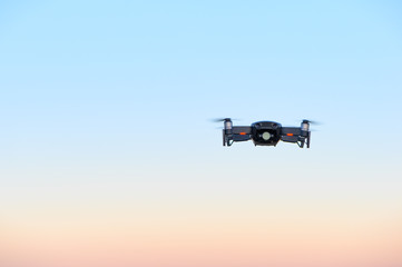 Drone in front of magical sunset sky